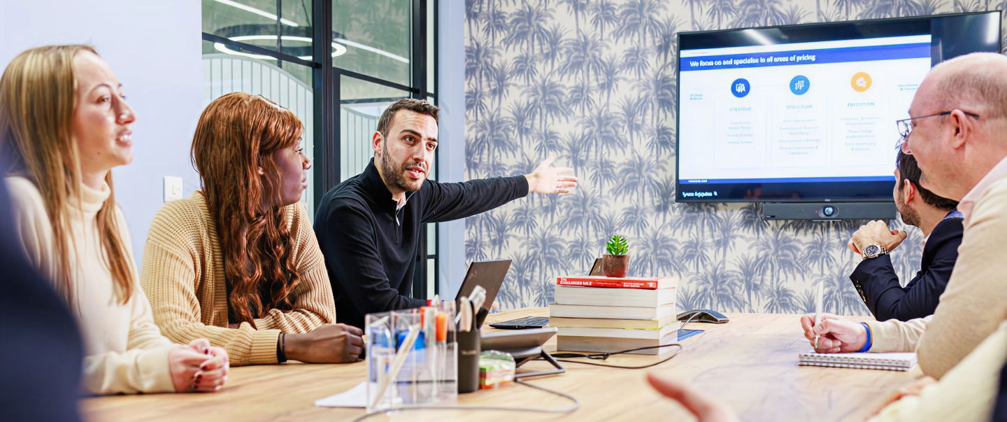 Factor Sales consultancy team discussing pricing strategy in a meeting room